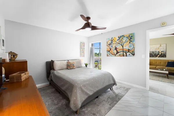 a bedroom with a bed and a table