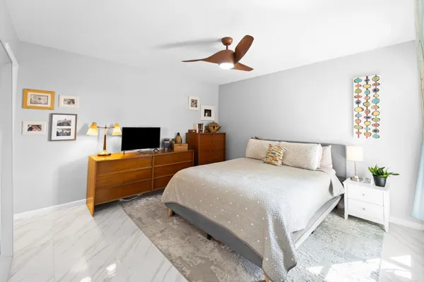 a bathroom with a sink a mirror a toilet and a shower