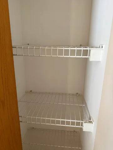 a view of a room with racks on the wall