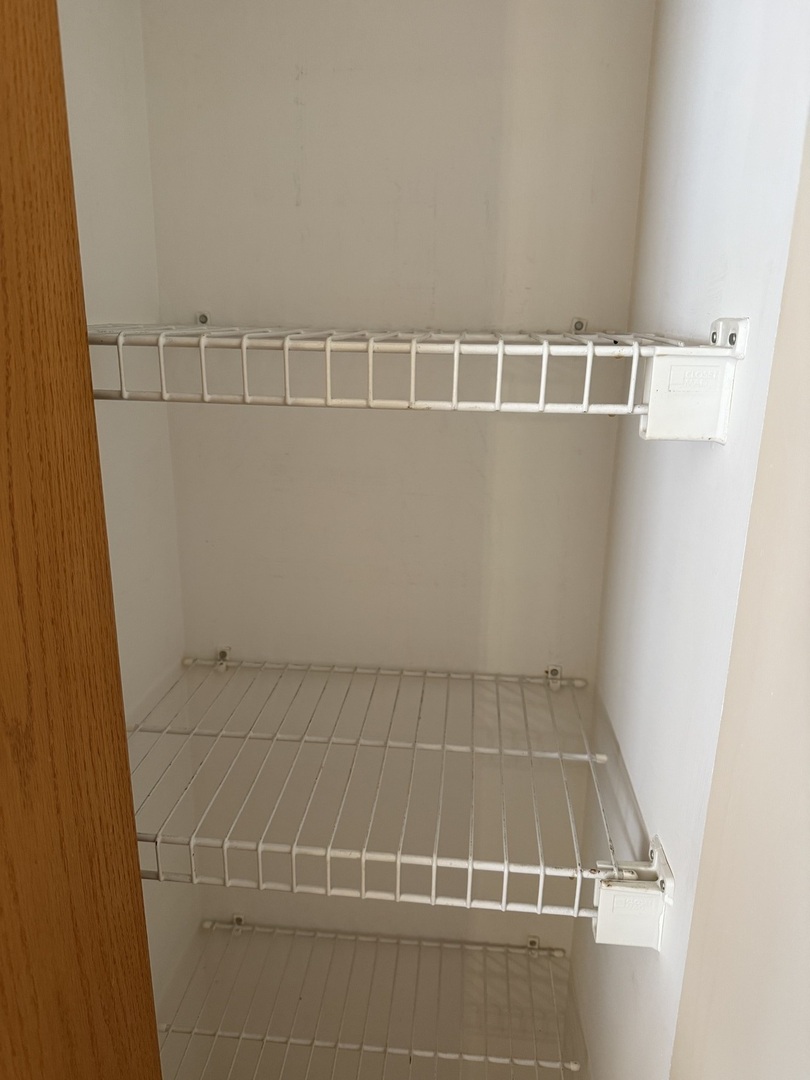 1604 Augusta Lane Shorewood, IL 60404 - Photo 12 of 32 a view of a room with racks on the wall