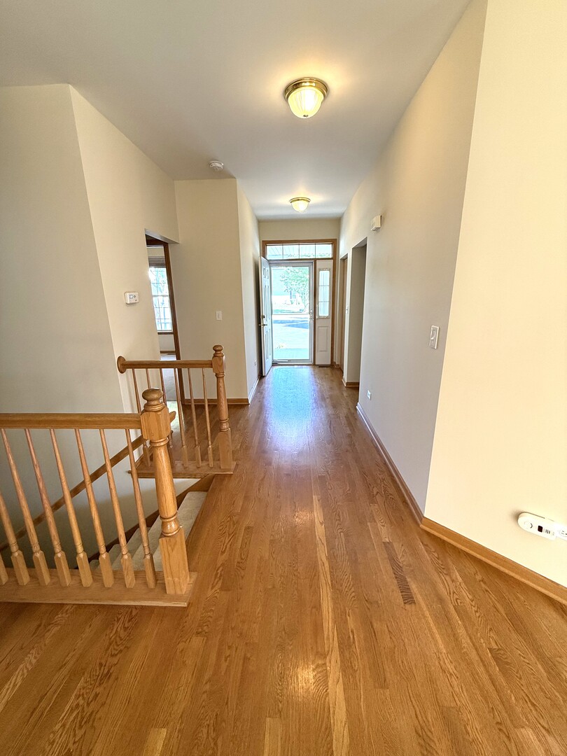 1604 Augusta Lane Shorewood, IL 60404 - Photo 13 of 32 a view of entryway with wooden floor