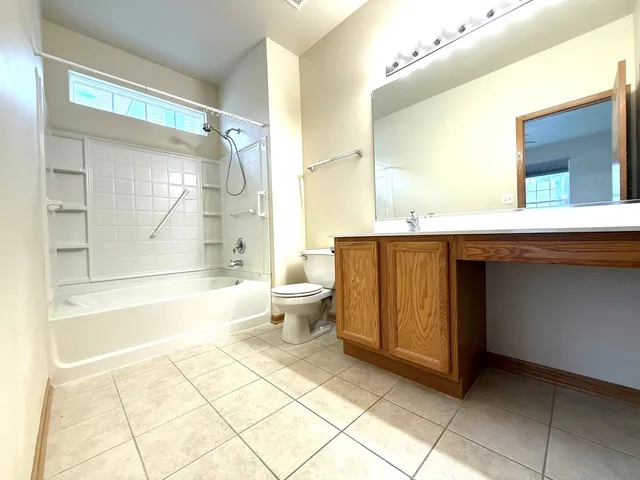 a spacious bathroom with a bathtub and a shower