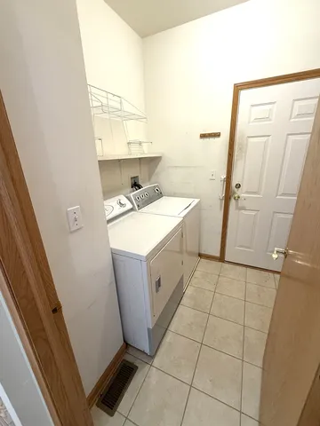 a utility room with a sink a washer and dryer