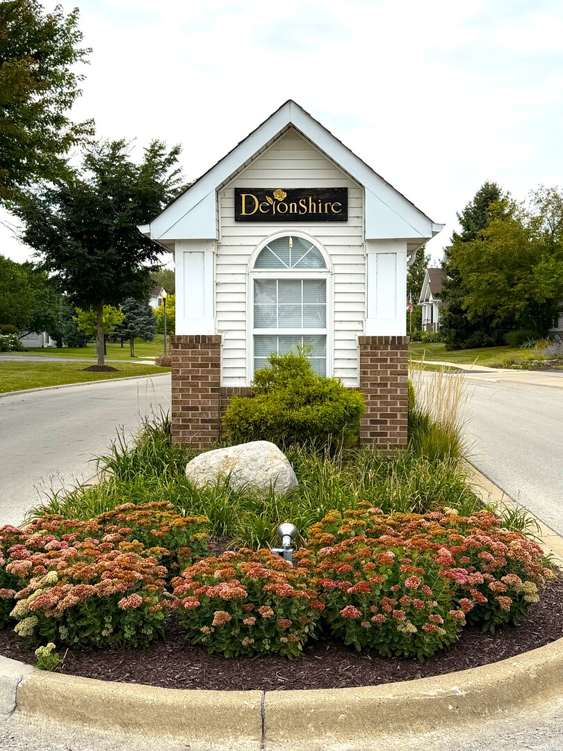 1604 Augusta Lane Shorewood, IL 60404 - Photo 25 of 32 a view of a house with a yard and plants