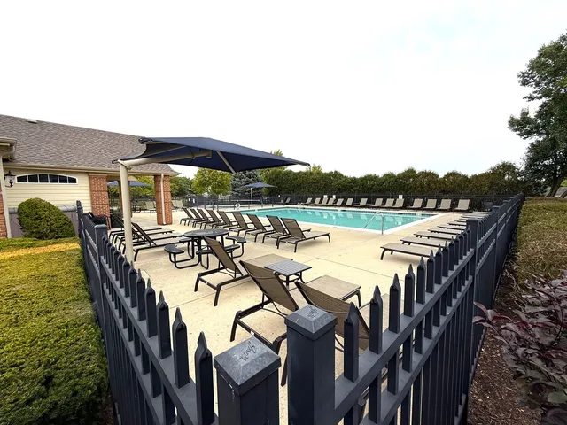 a view of a patio with swimming pool