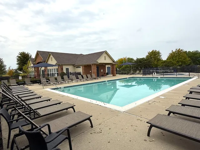 a view of swimming pool with outdoor seating