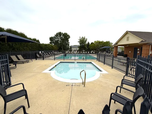 a view of a swimming pool with a lounge chair