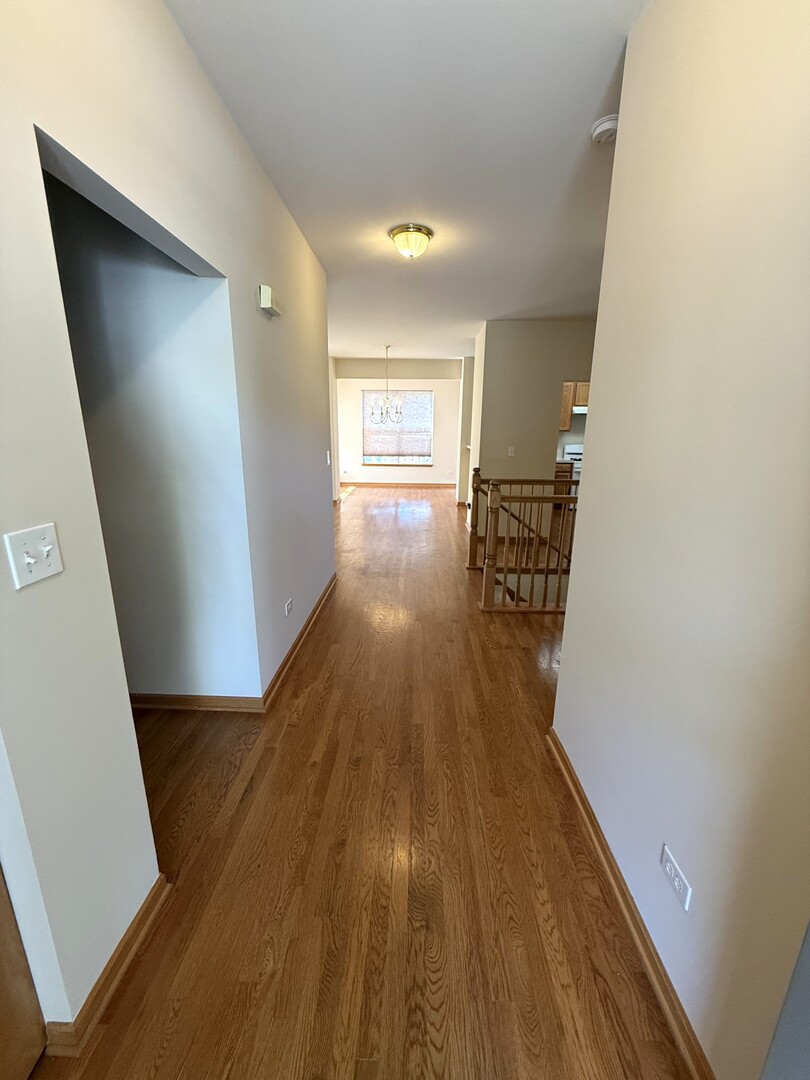 1604 Augusta Lane Shorewood, IL 60404 - Photo 4 of 32 a view of entryway with wooden floor