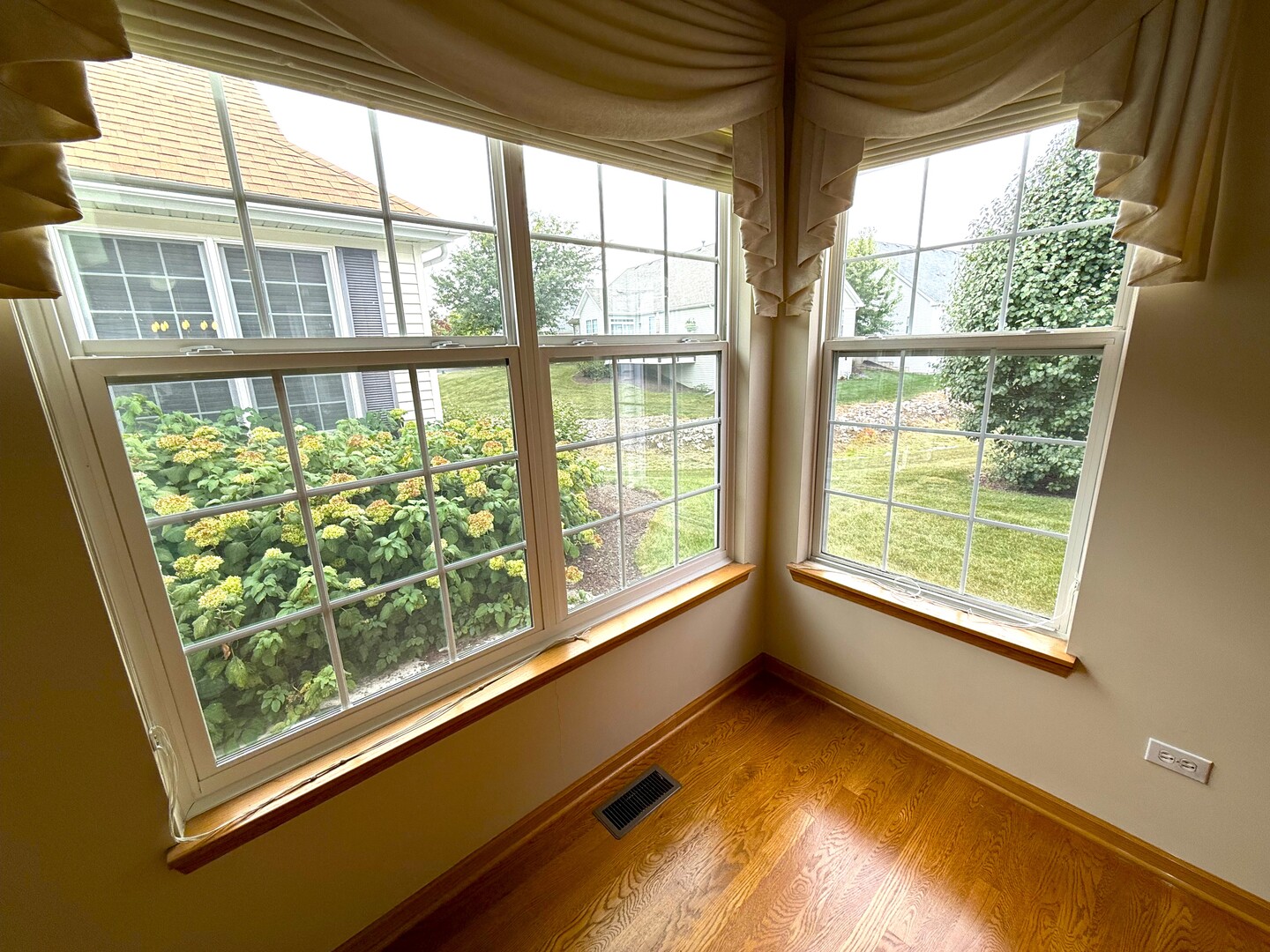 1604 Augusta Lane Shorewood, IL 60404 - Photo 7 of 32 a view of an empty room with a window