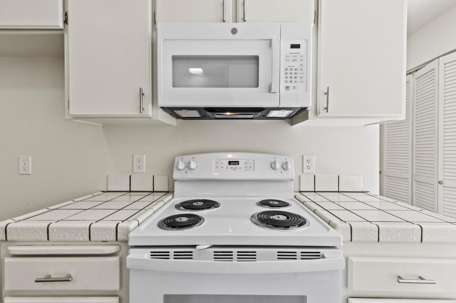 750 Lincoln Road, Unit 82 Yuba City, CA 95991 - Photo 12 of 35 a white stove top oven sitting inside of a kitchen