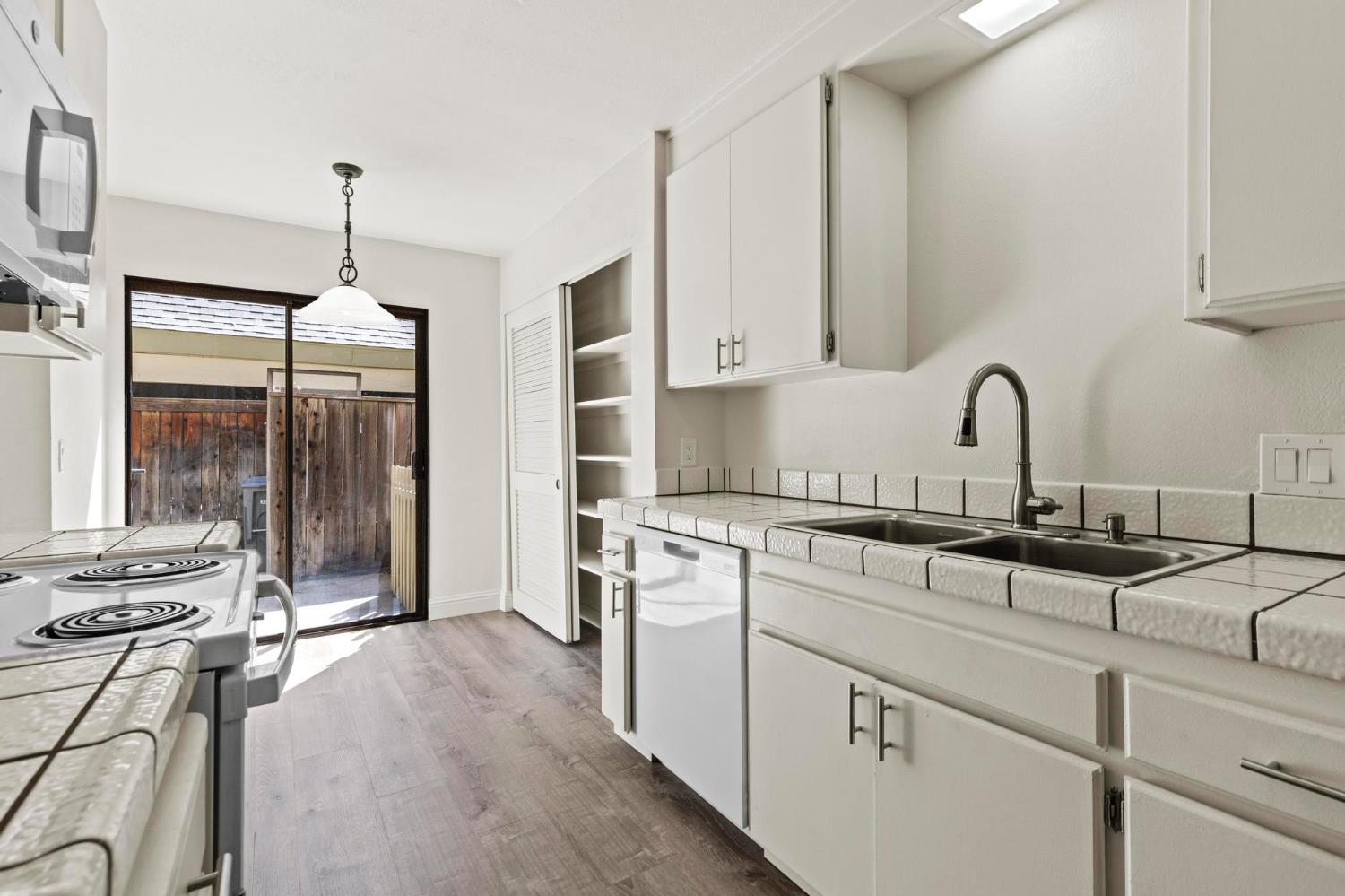 750 Lincoln Road, Unit 82 Yuba City, CA 95991 - Photo 13 of 35 a kitchen with a sink stove and cabinets