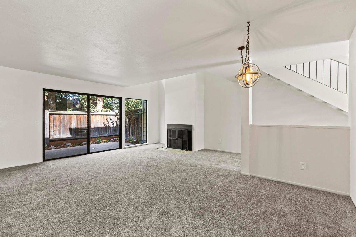 750 Lincoln Road, Unit 82 Yuba City, CA 95991 - Photo 14 of 35 a view of an empty room with a fireplace and a window