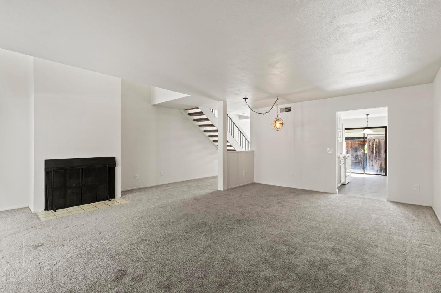 750 Lincoln Road, Unit 82 Yuba City, CA 95991 - Photo 15 of 35 an empty room with windows and fireplace