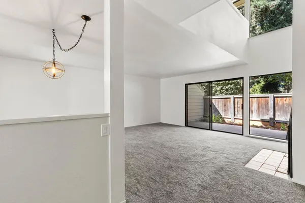 a view of a hallway with windows