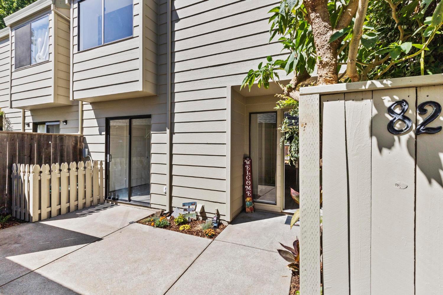 750 Lincoln Road, Unit 82 Yuba City, CA 95991 - Photo 2 of 35 a view of a house with potted plants and a bench
