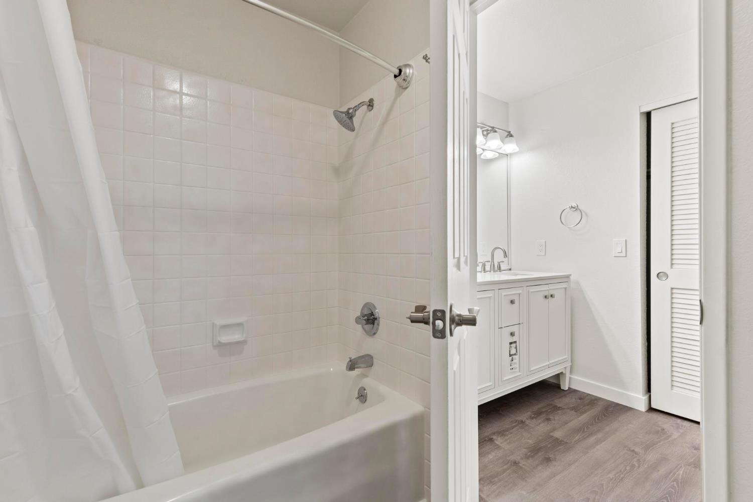 750 Lincoln Road, Unit 82 Yuba City, CA 95991 - Photo 23 of 35 a bathroom with a bathtub a sink and a shower