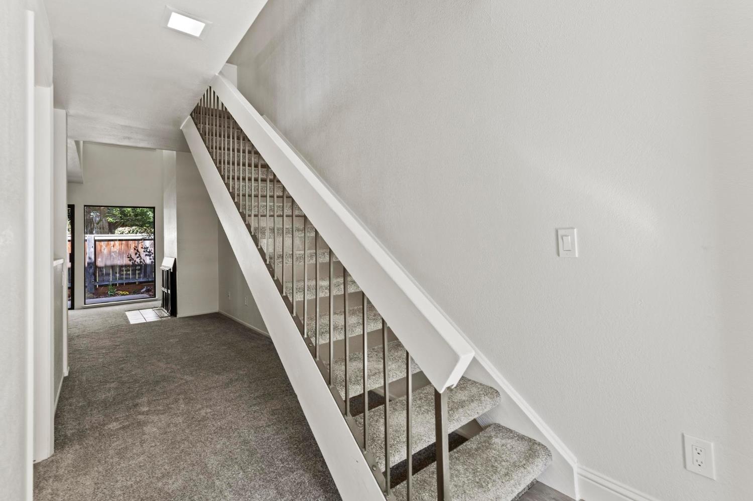 750 Lincoln Road, Unit 82 Yuba City, CA 95991 - Photo 3 of 35 a view of staircase with railing and white walls