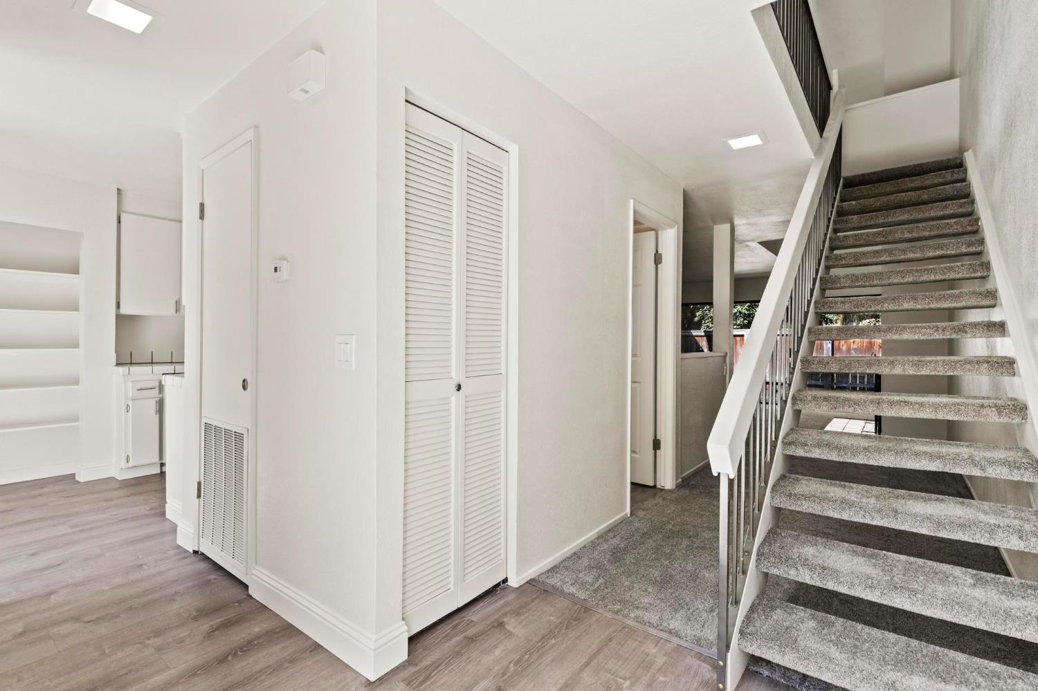 750 Lincoln Road, Unit 82 Yuba City, CA 95991 - Photo 4 of 35 a view of a hallway with wooden floor and entryway