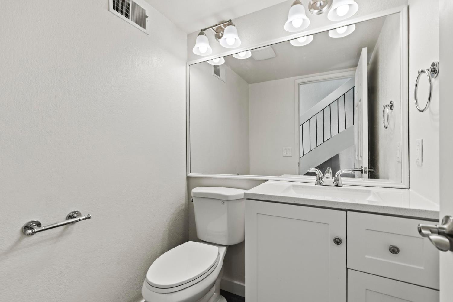 750 Lincoln Road, Unit 82 Yuba City, CA 95991 - Photo 5 of 35 a bathroom with a toilet sink and mirror