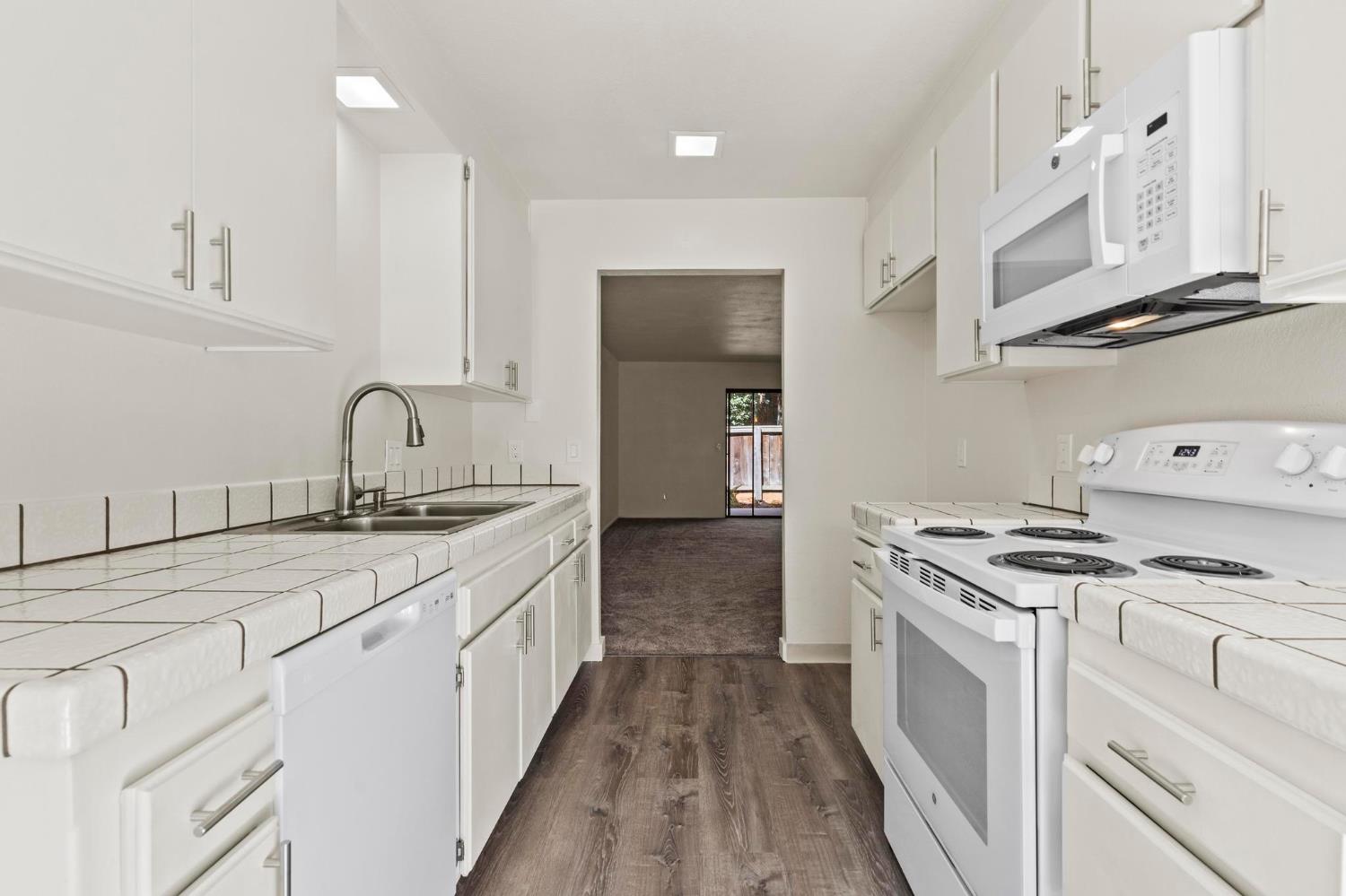 750 Lincoln Road, Unit 82 Yuba City, CA 95991 - Photo 10 of 35 a kitchen with stainless steel appliances granite countertop a sink stove and cabinets