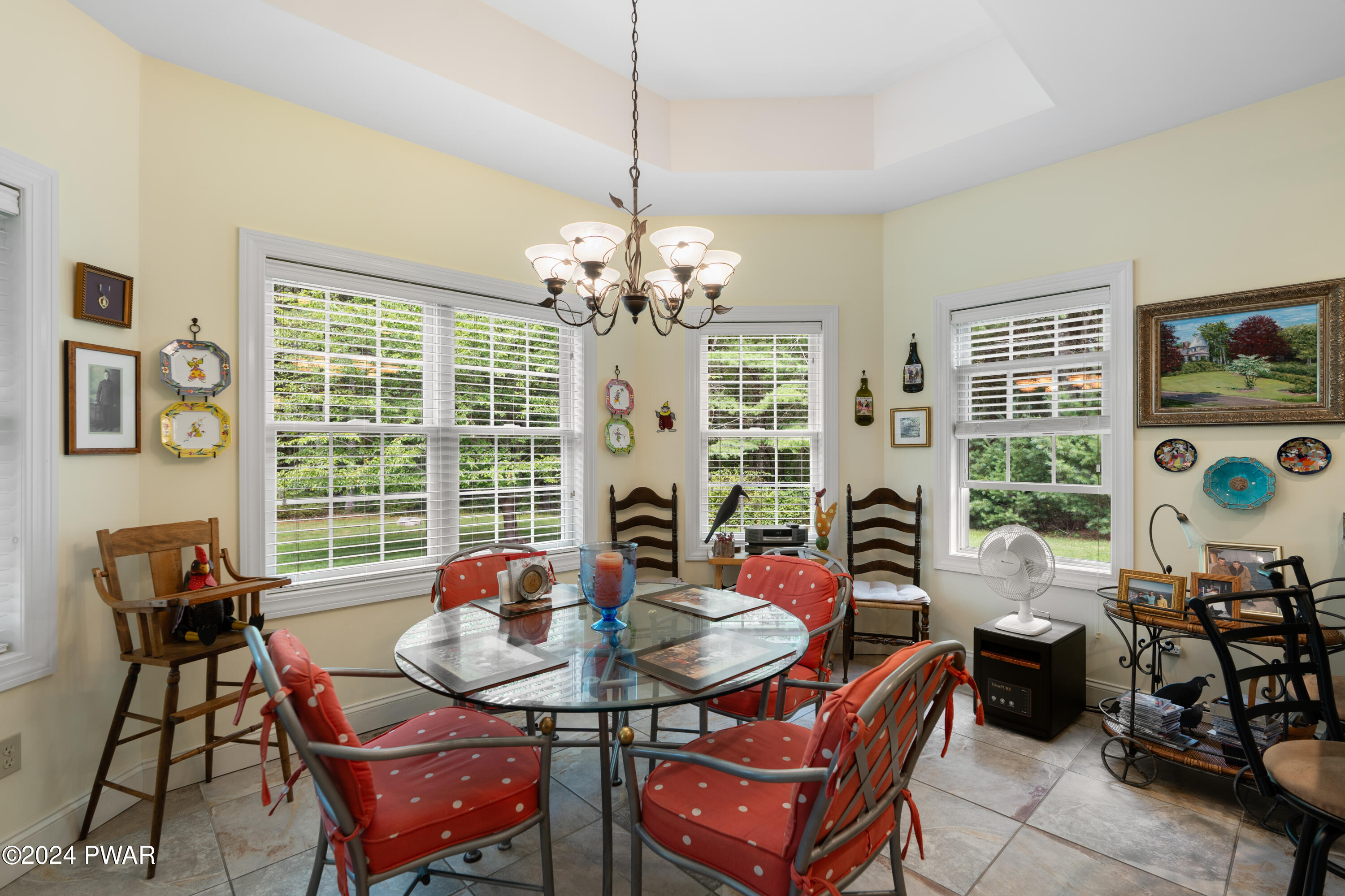 208 Long Meadow Road Milford, PA 18337 - Photo 26 of 64 a view of a dining room with furniture and chandelier