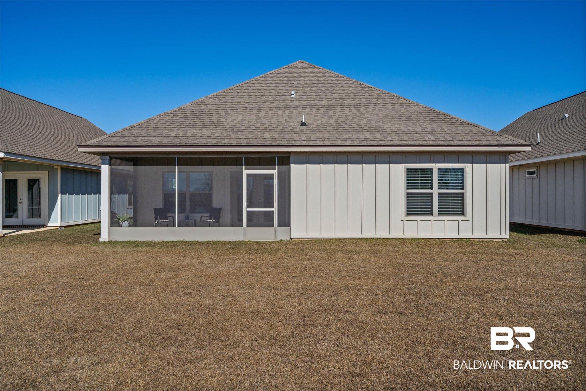 9346 Swan Point Road Daphne, AL 36526 - Photo 20 of 28 Featuring screened porch, looking from the backyard.