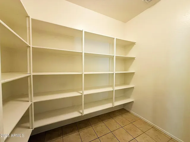 a view of an empty room with empty racks