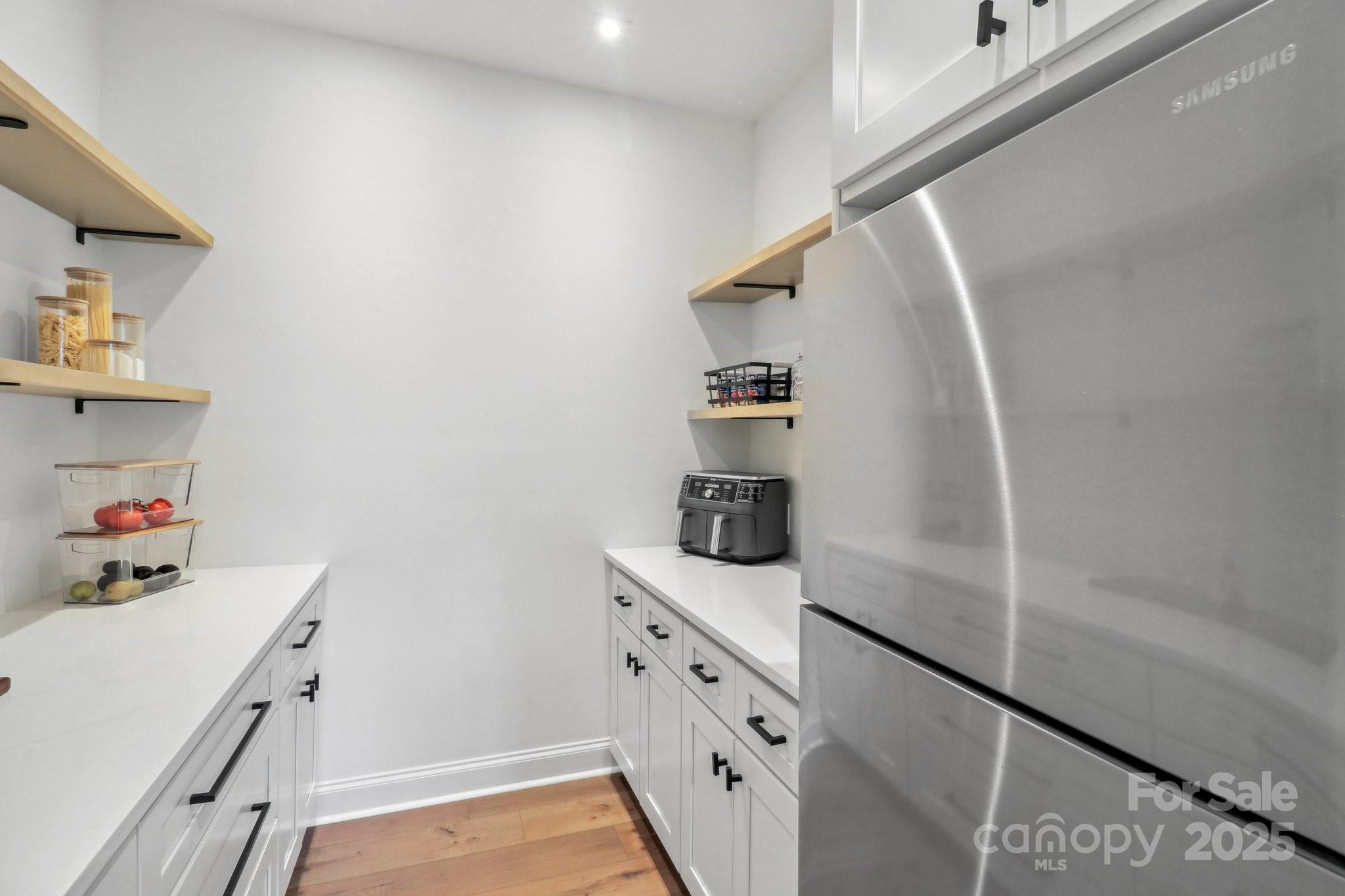 545 Morrison Farm Road Troutman, NC 28166 - Photo 13 of 31 a view of storage and utility room with empty racks