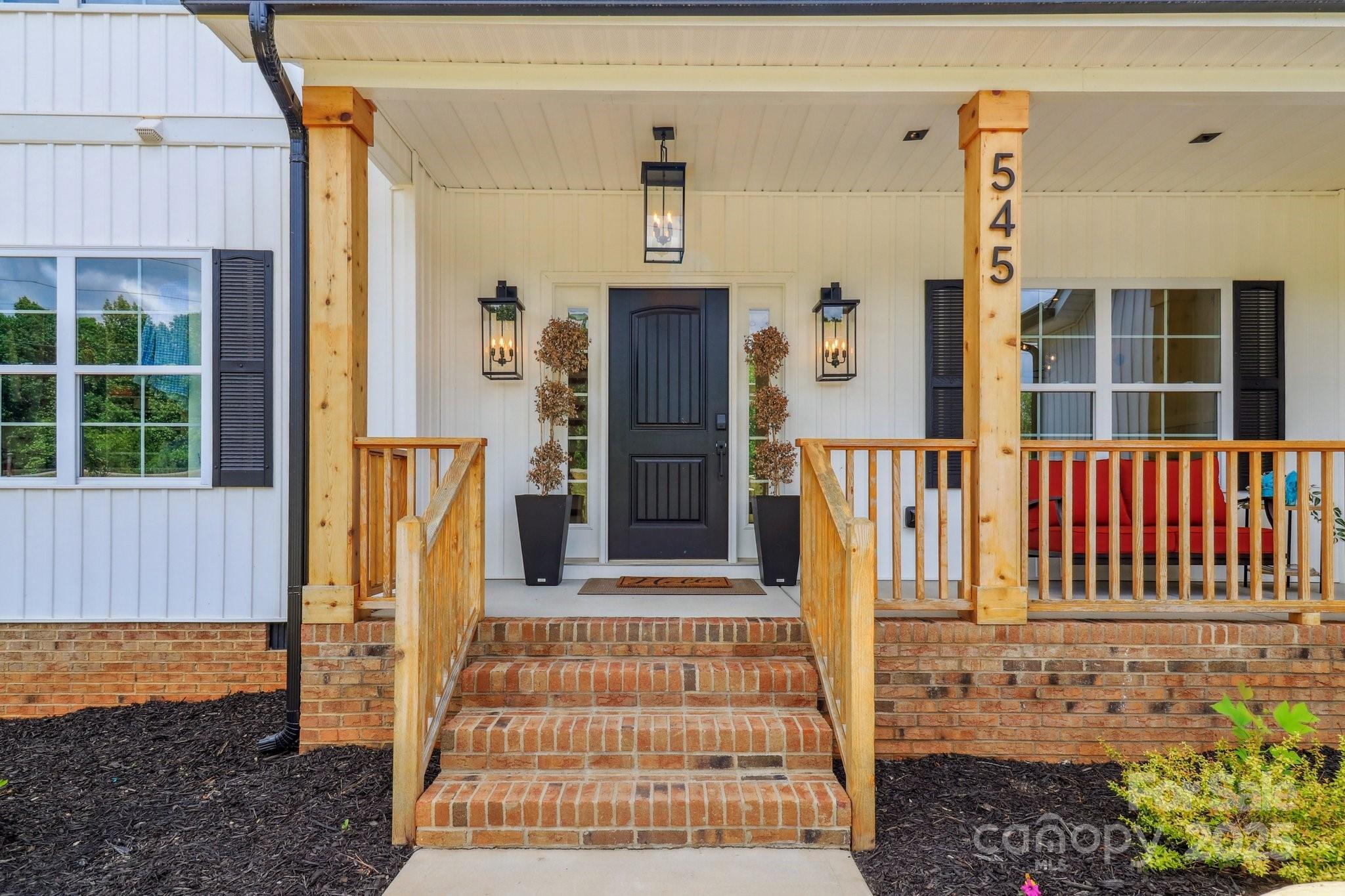545 Morrison Farm Road Troutman, NC 28166 - Photo 2 of 31 a front view of a house with a porch