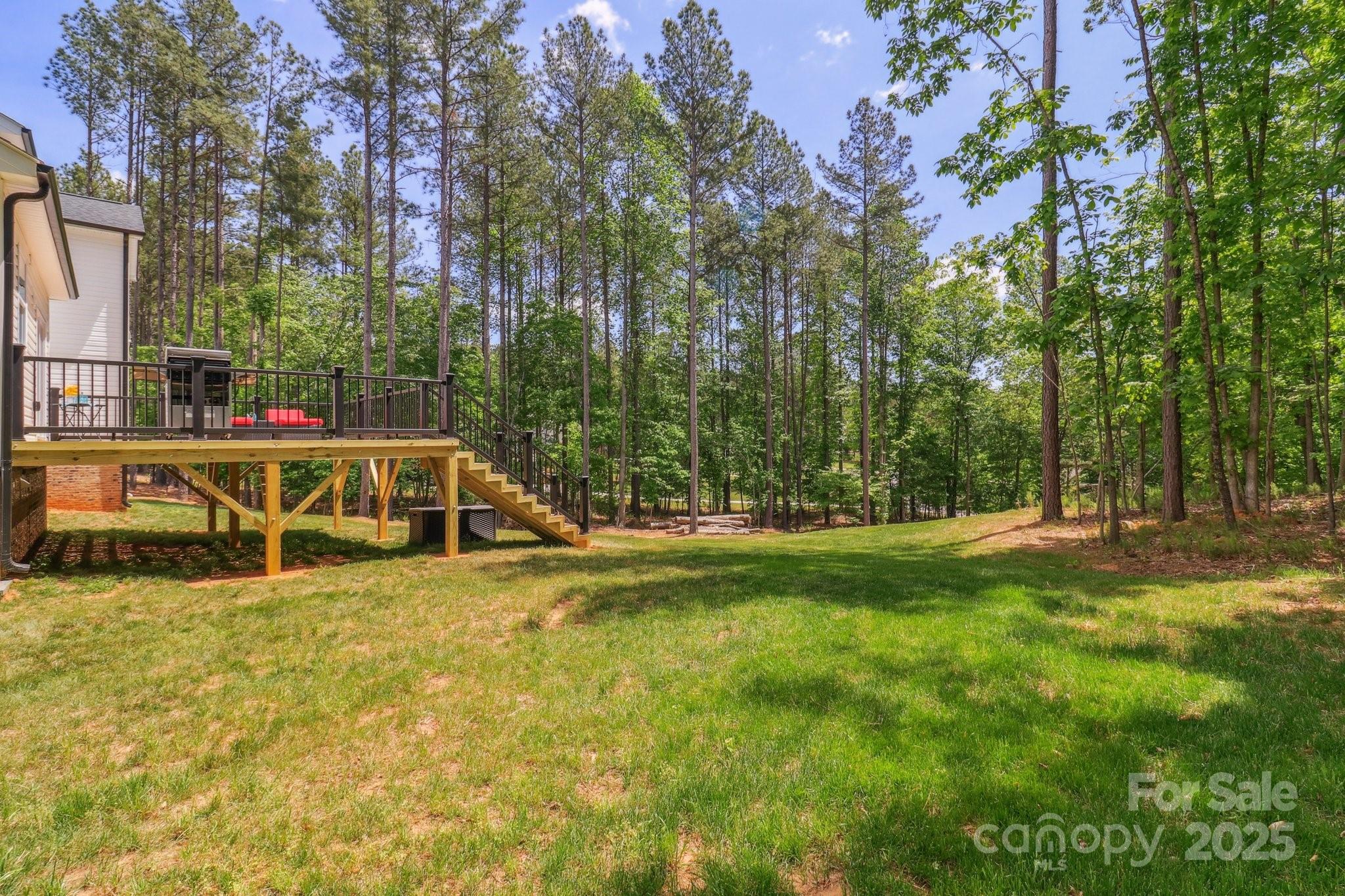 545 Morrison Farm Road Troutman, NC 28166 - Photo 27 of 31 a view of swimming pool with lawn chairs and large trees