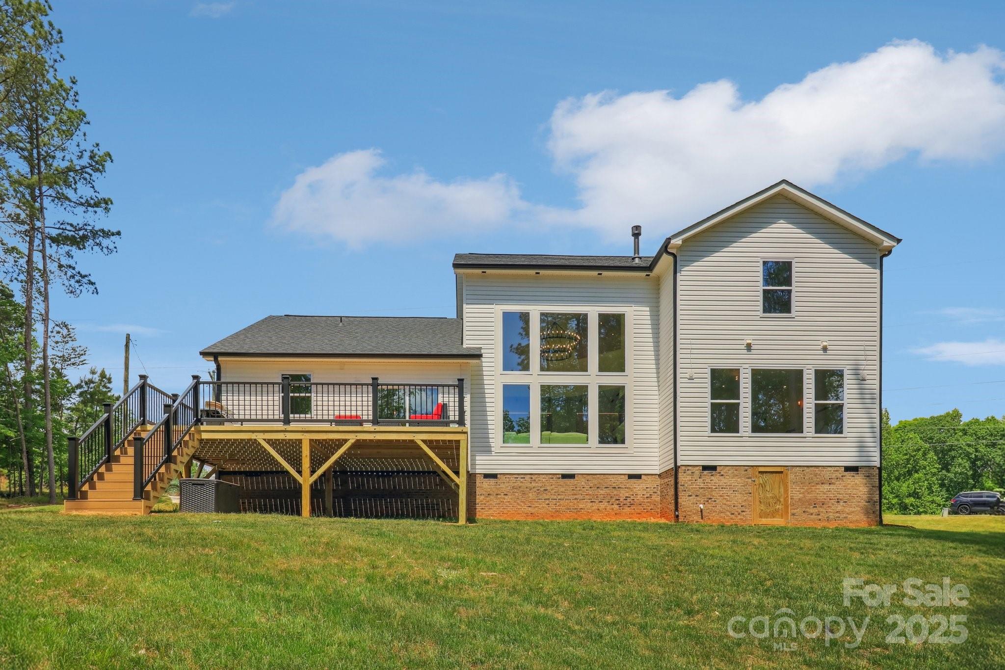 545 Morrison Farm Road Troutman, NC 28166 - Photo 28 of 31 a view of a house with a yard and a garden