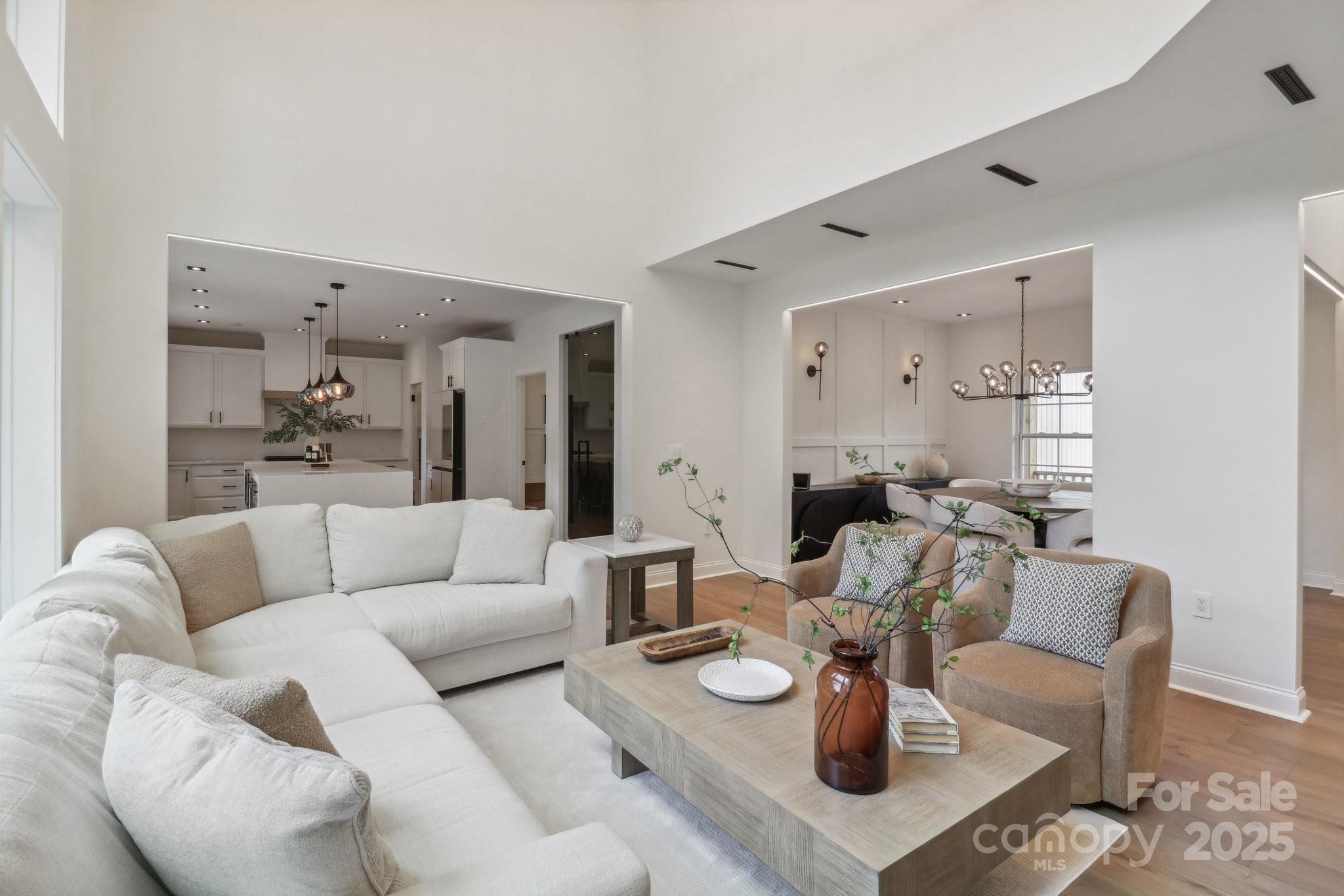 545 Morrison Farm Road Troutman, NC 28166 - Photo 5 of 31 a living room with furniture and a dining table