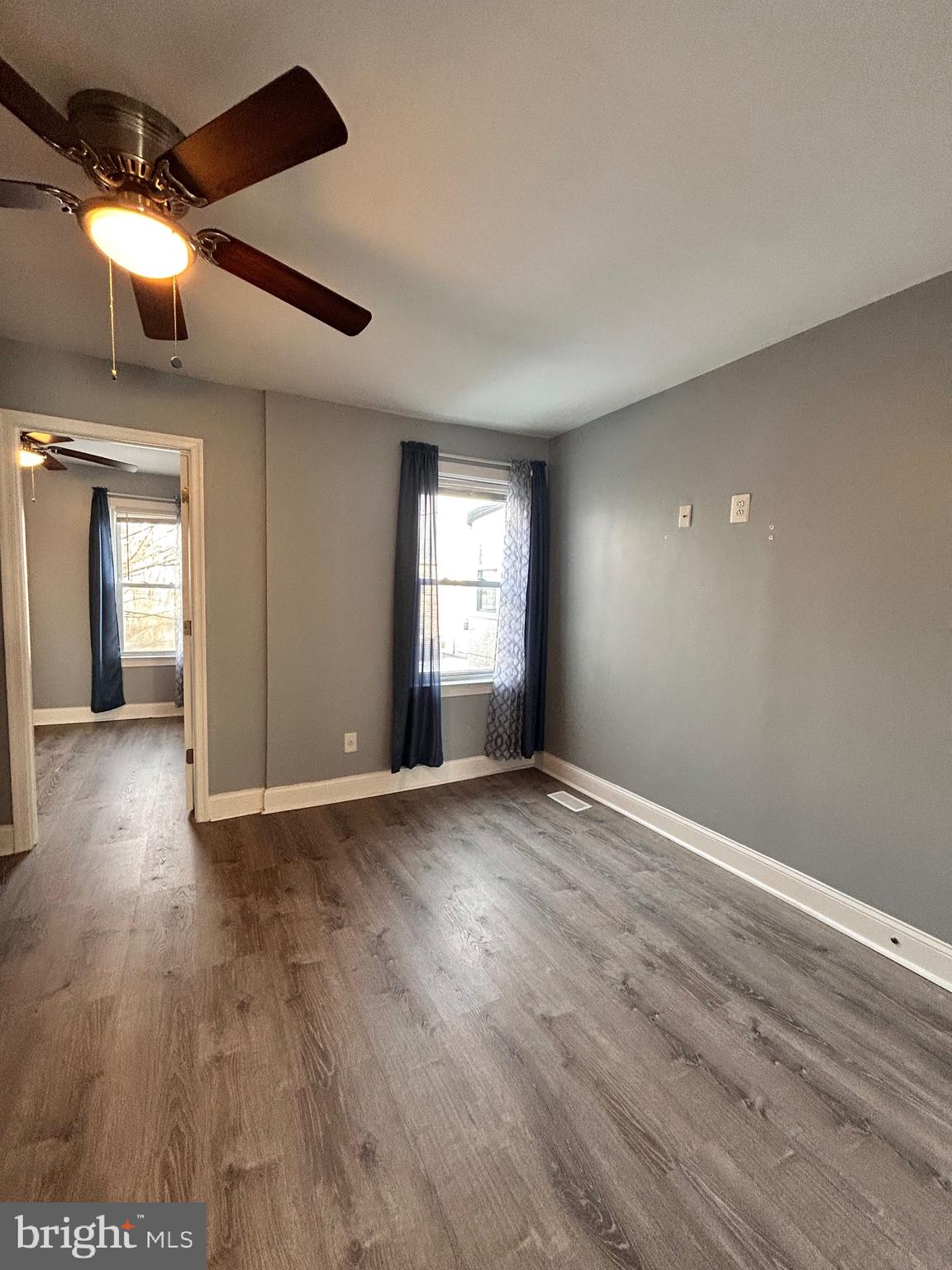 3541 3rd Street Baltimore, MD 21225 - Photo 14 of 37 a view of an empty room with window and wooden floor