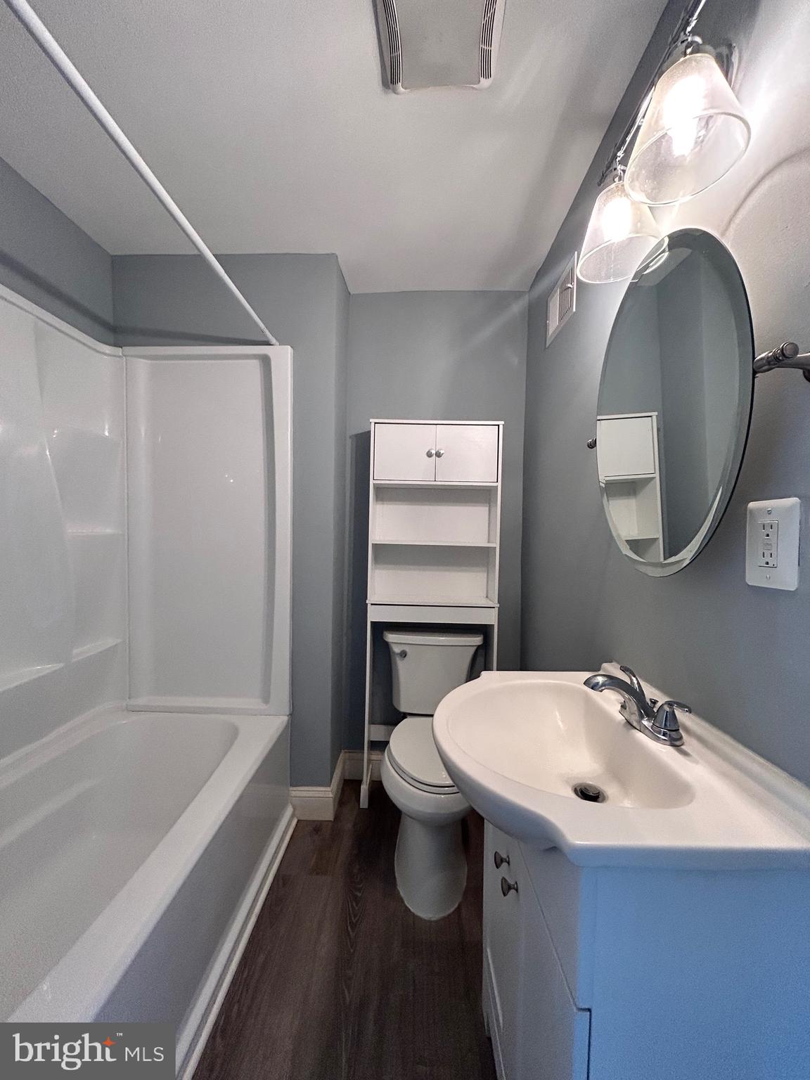 3541 3rd Street Baltimore, MD 21225 - Photo 18 of 37 a bathroom with a sink a toilet and a bathtub