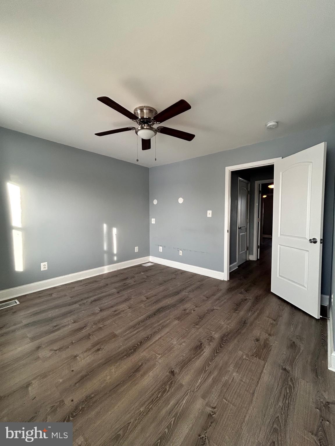3541 3rd Street Baltimore, MD 21225 - Photo 19 of 37 a view of an empty room and wooden floor