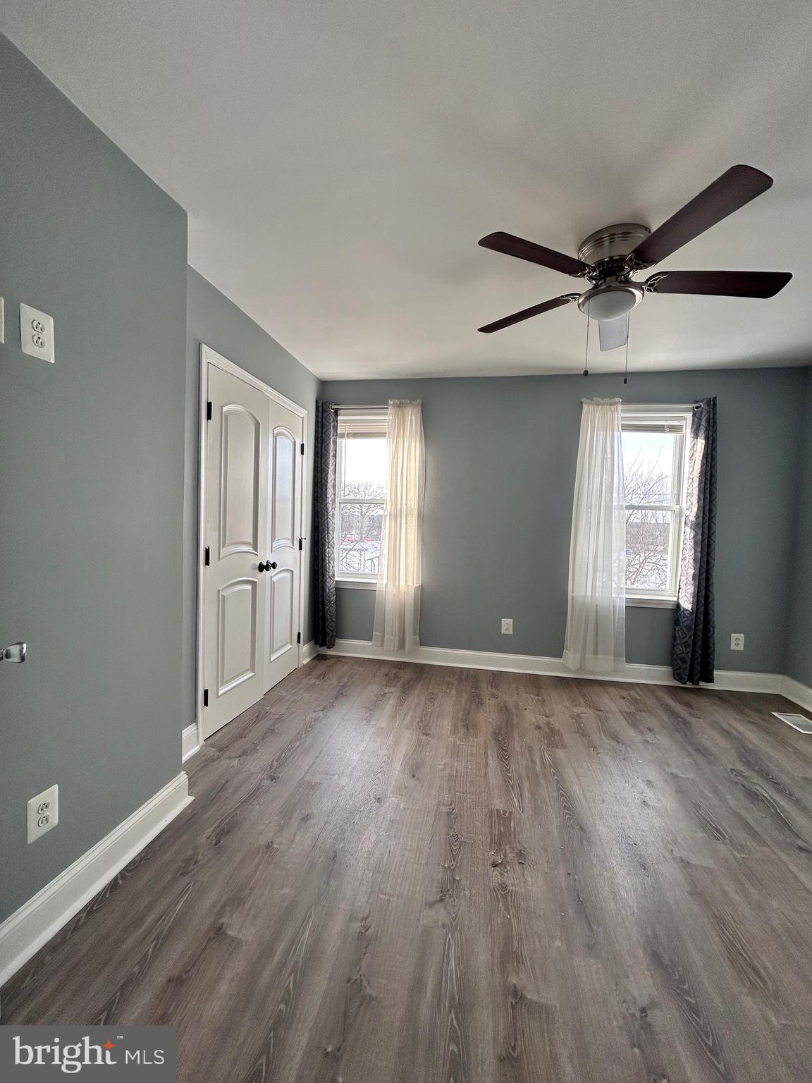 3541 3rd Street Baltimore, MD 21225 - Photo 20 of 37 an empty room with wooden floor and windows