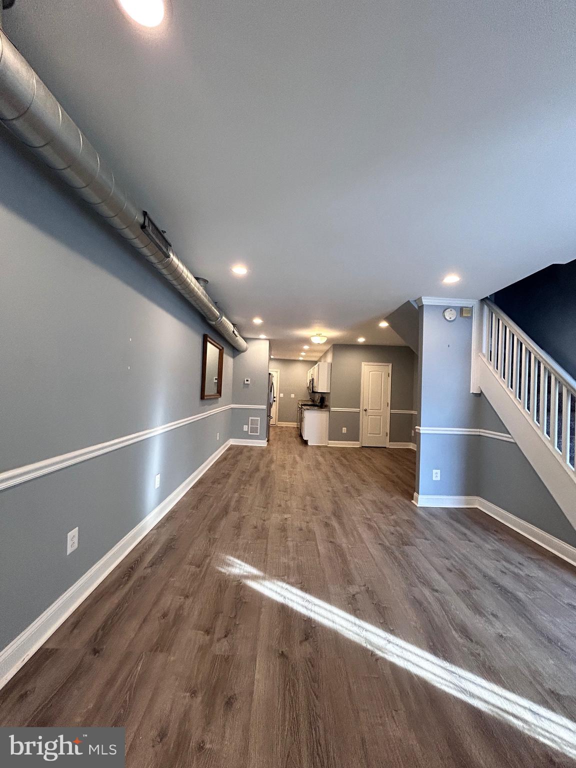 3541 3rd Street Baltimore, MD 21225 - Photo 2 of 37 a view of a hallway with wooden floor