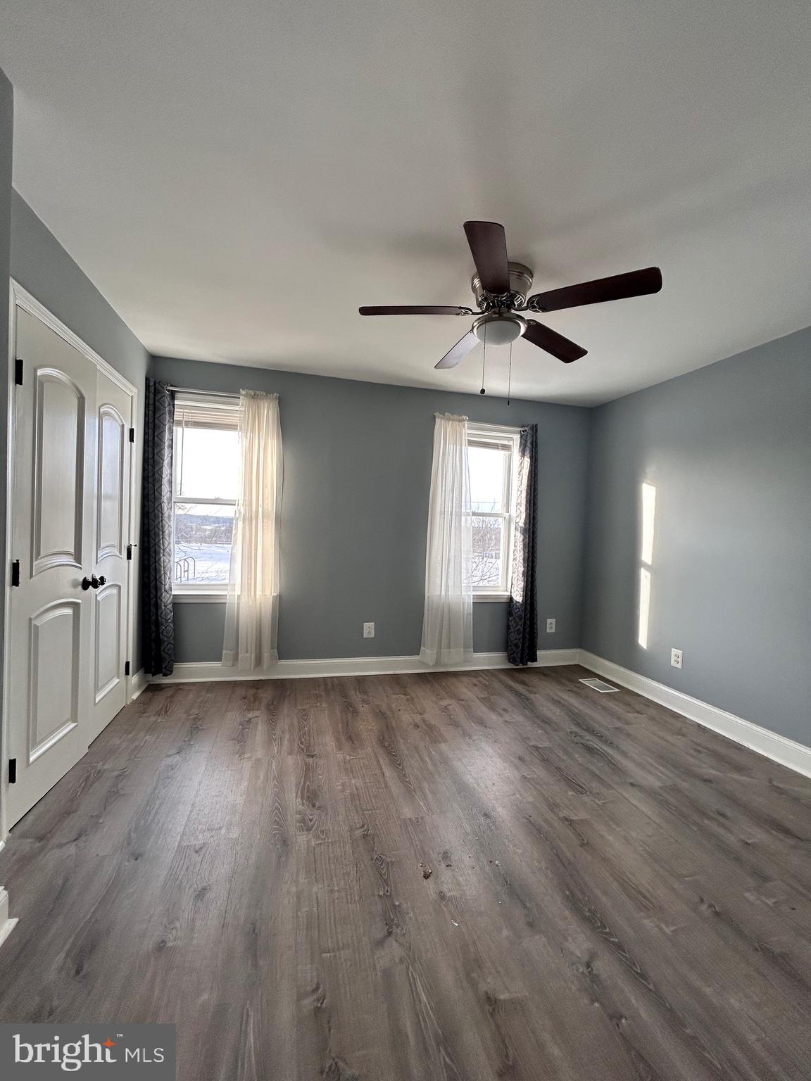 3541 3rd Street Baltimore, MD 21225 - Photo 21 of 37 a view of an empty room with a window and wooden floor