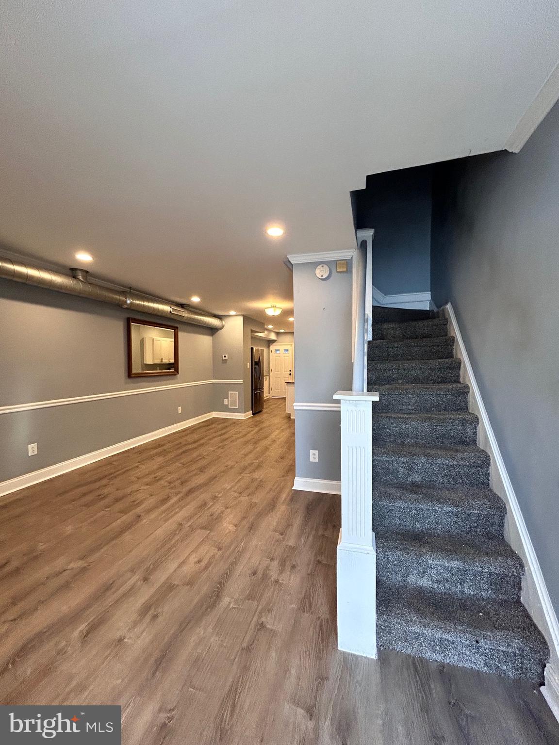 3541 3rd Street Baltimore, MD 21225 - Photo 22 of 37 a view of entryway and hall with wooden floor