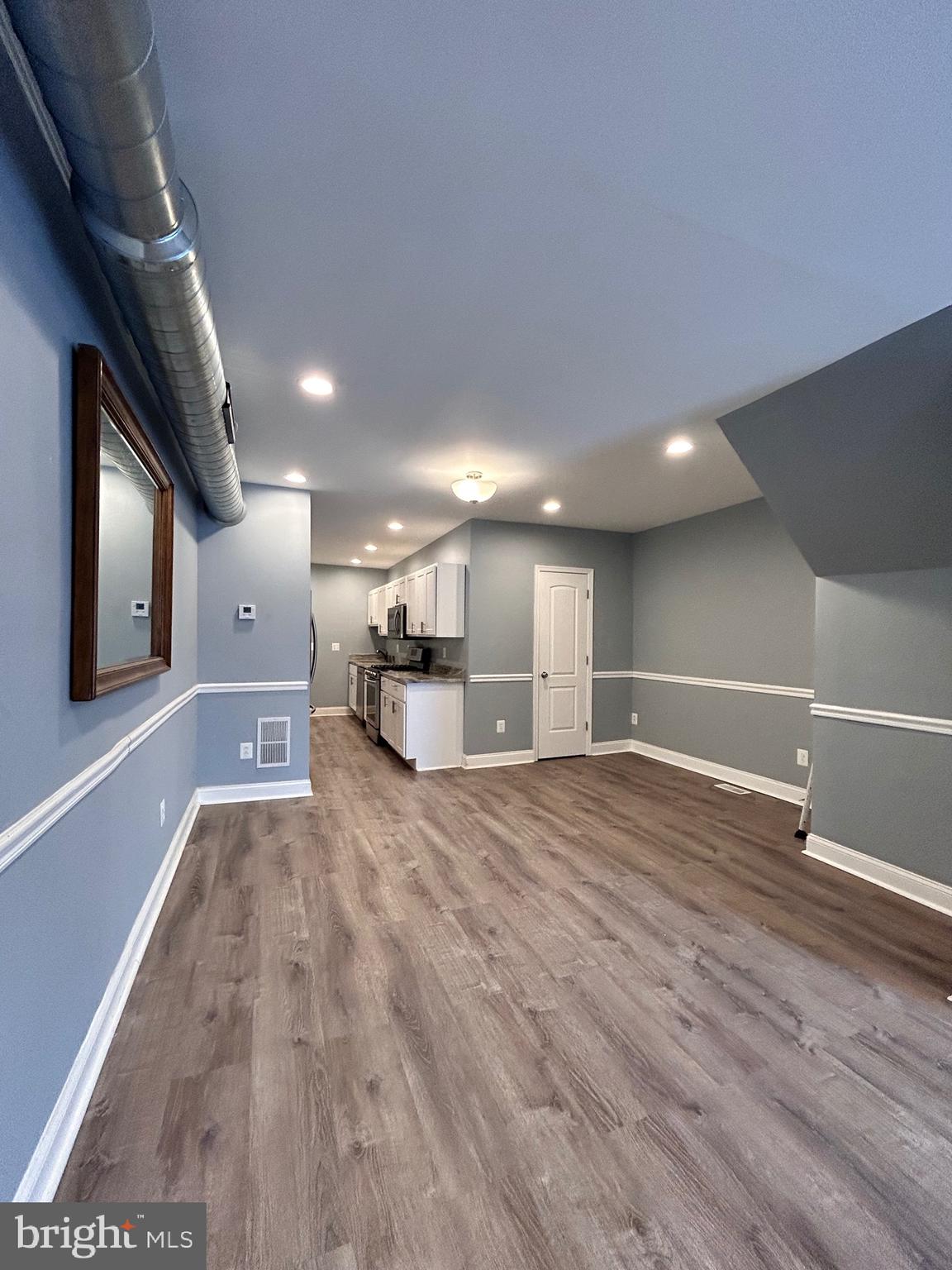 3541 3rd Street Baltimore, MD 21225 - Photo 23 of 37 a view of empty room with wooden floor
