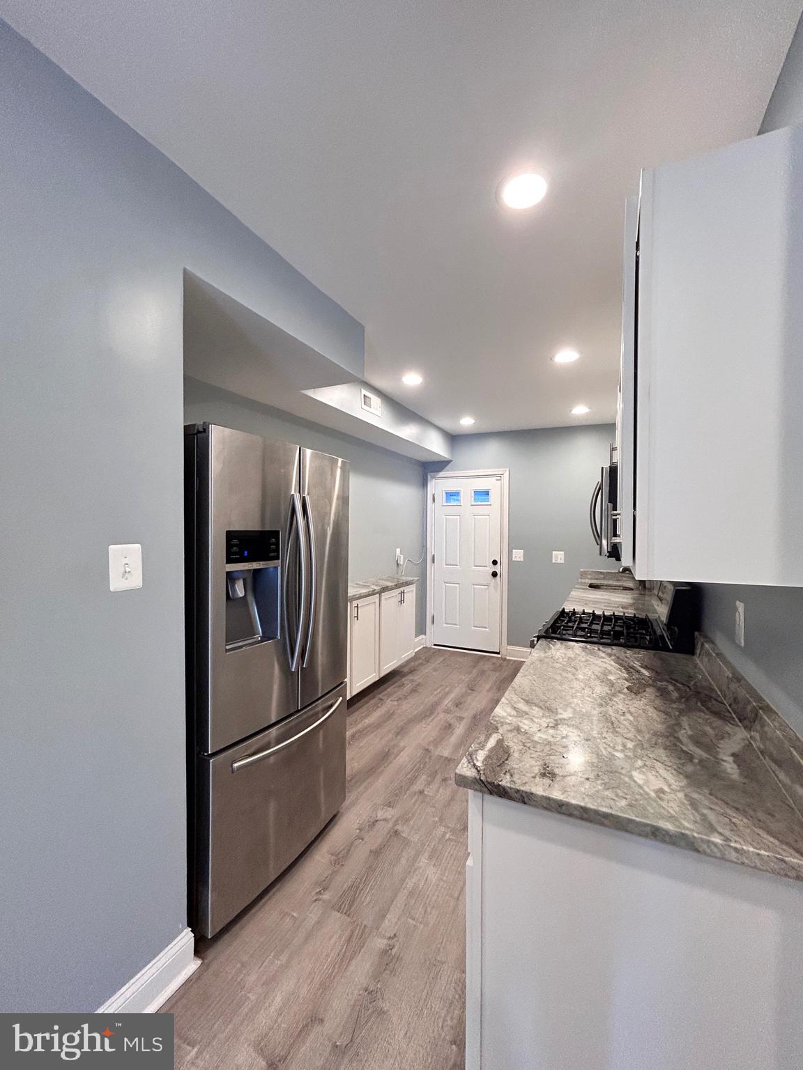 3541 3rd Street Baltimore, MD 21225 - Photo 3 of 37 a kitchen with a refrigerator and a sink
