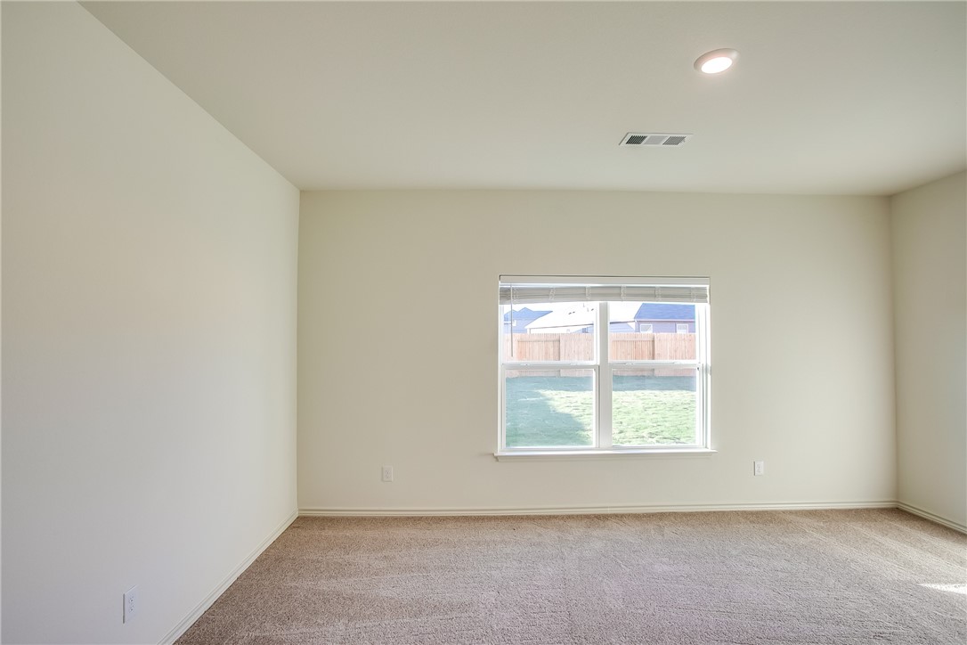 19024 Quiet Range Drive Elgin, TX 78621 - Photo 15 of 30 an empty room with windows
