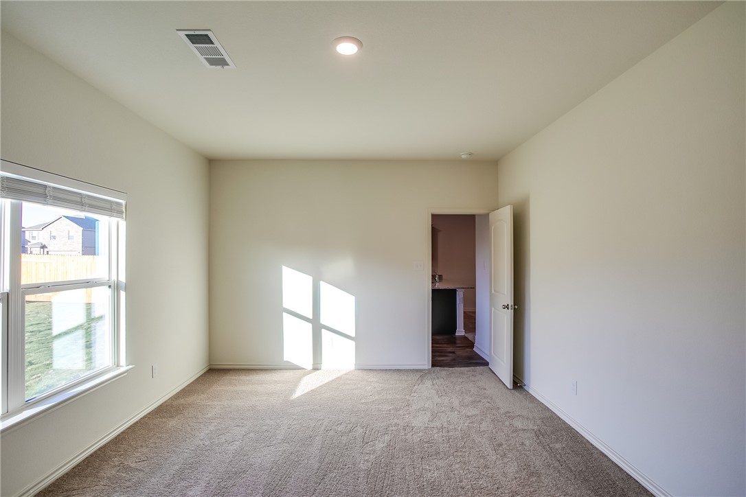 19024 Quiet Range Drive Elgin, TX 78621 - Photo 16 of 30 an empty room with windows and closet