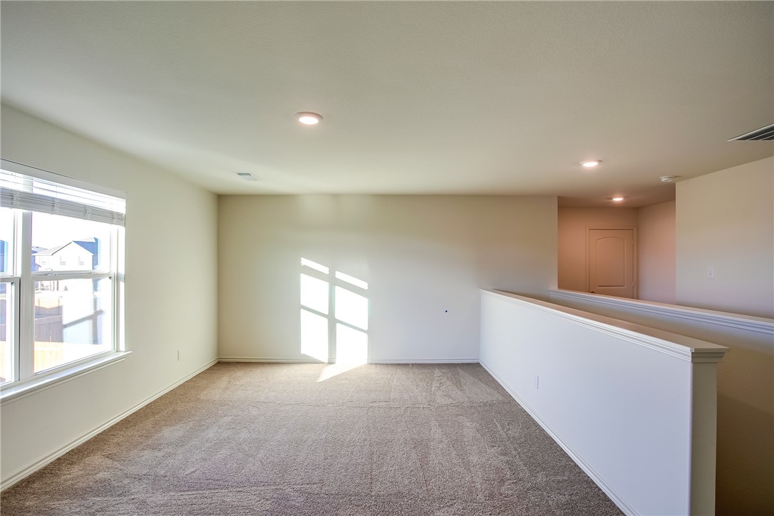 19024 Quiet Range Drive Elgin, TX 78621 - Photo 19 of 30 a view of an empty room with a window