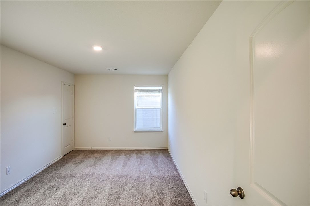 19024 Quiet Range Drive Elgin, TX 78621 - Photo 22 of 30 an empty room with a window