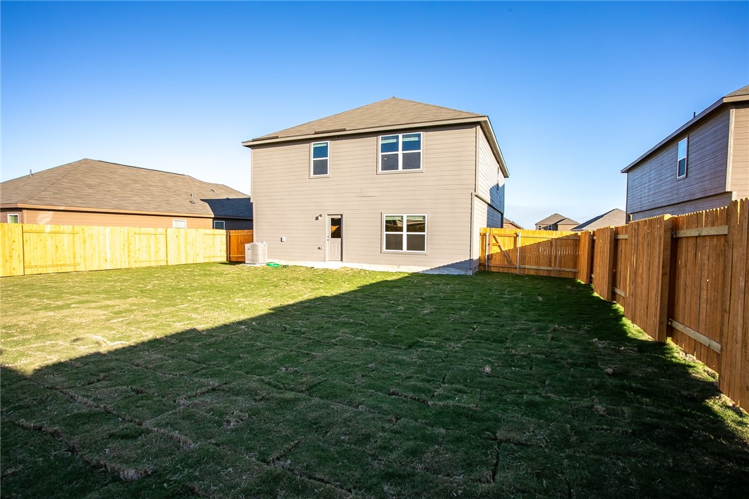 19024 Quiet Range Drive Elgin, TX 78621 - Photo 27 of 30 a front view of a house with a yard