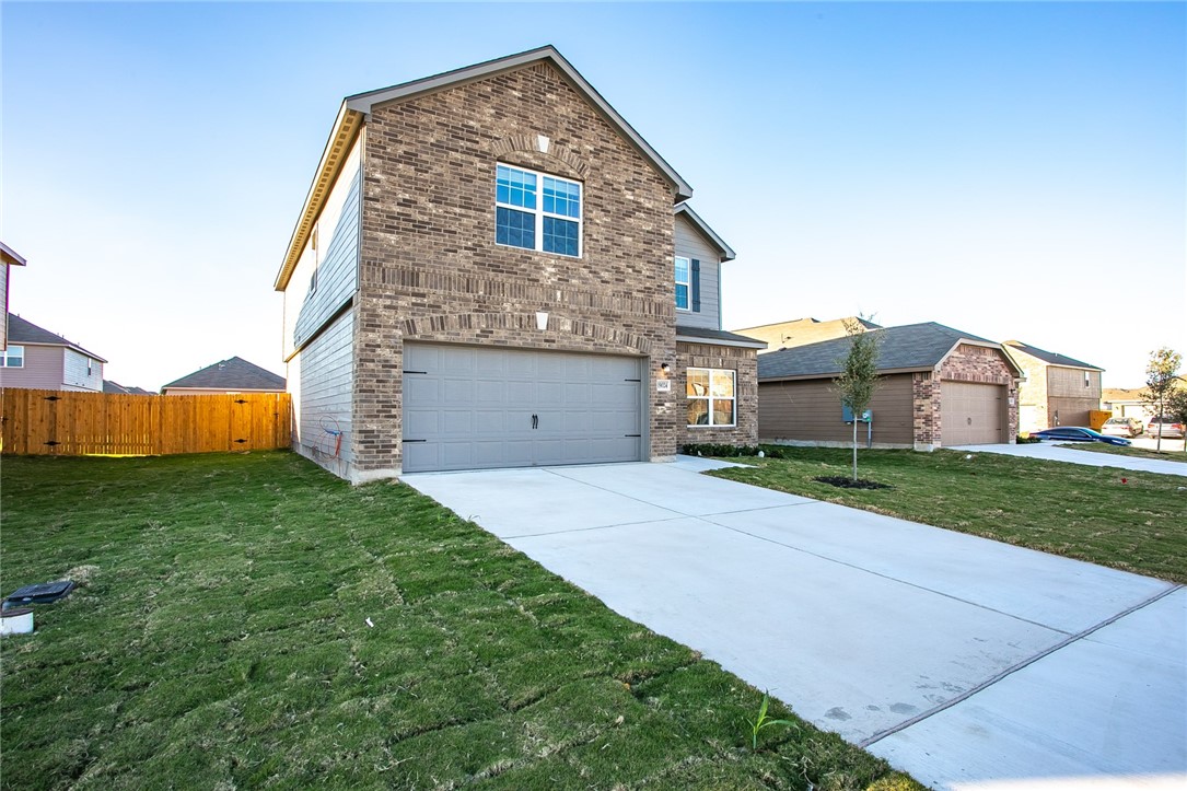 19024 Quiet Range Drive Elgin, TX 78621 - Photo 3 of 30 a view of a house with a yard