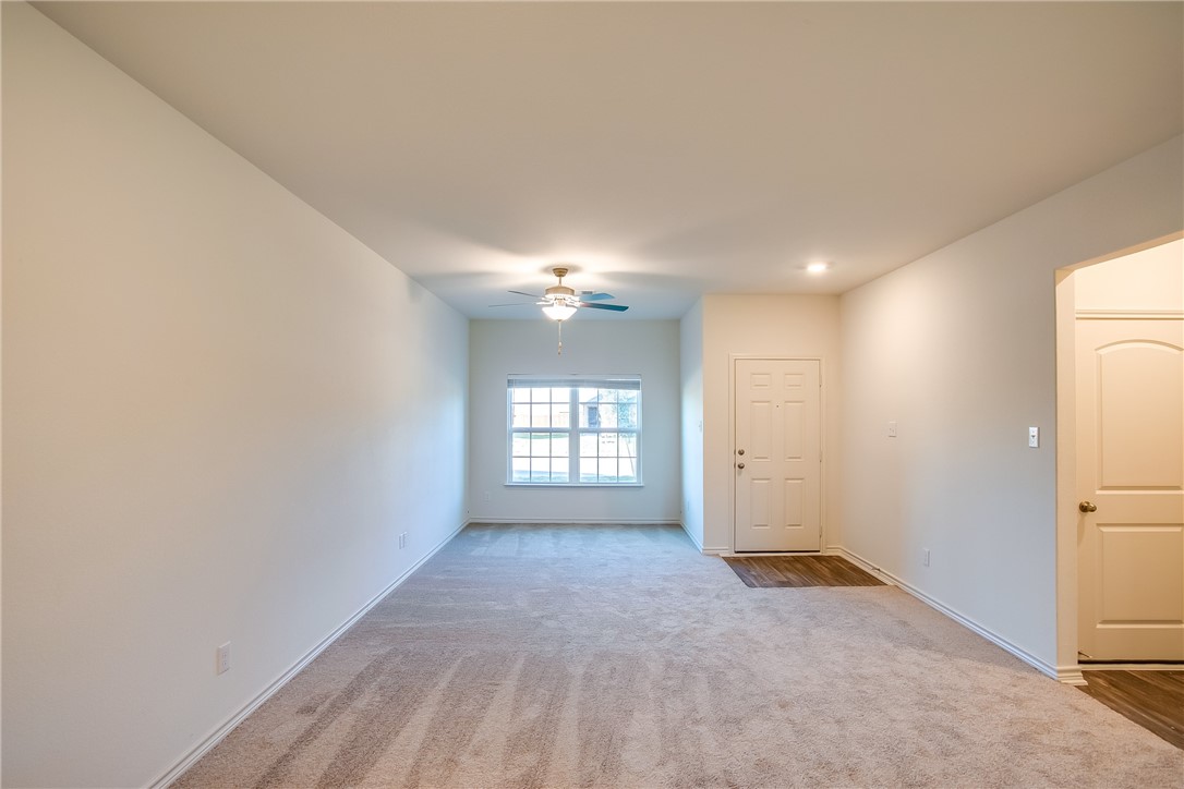 19024 Quiet Range Drive Elgin, TX 78621 - Photo 6 of 30 a view of a big room with windows and closet