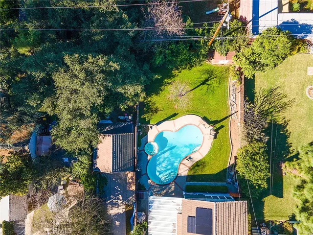 an aerial view of a house with a lake view