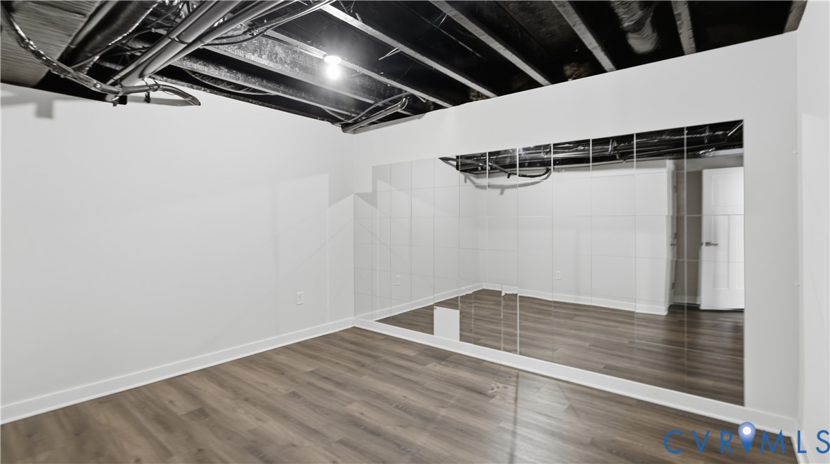 9308 Rudders Point Cove Mechanicsville, VA 23116 - Photo 36 of 50 Wood-finish flooring, white walls, and a mirrored
